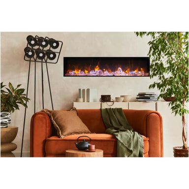Amantii Panorama BI Deep Electric Fireplace installed above the cozy couch with beautiful fixtures beside