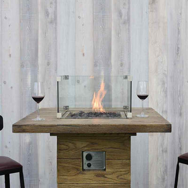 Elementi Rova Bar Table showing flames with wines and chairs on the side