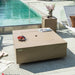 Functioning as a table on your Capertee Square Concrete Fire Table by Elementi Plus