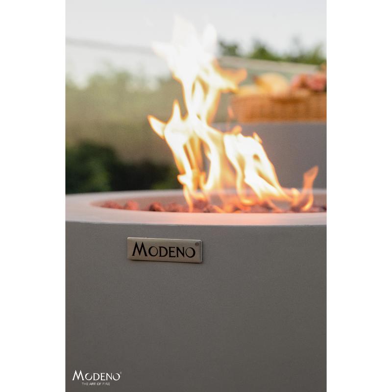 Mesmerizing flames are available on the Waterford Round Concrete Fire Pit by Modeno