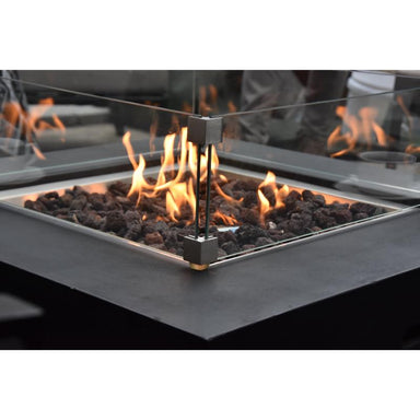Modeno Aurora Square Concrete Fire Pit showcasing its flames with the optional windscreen to provide heat outdoors
