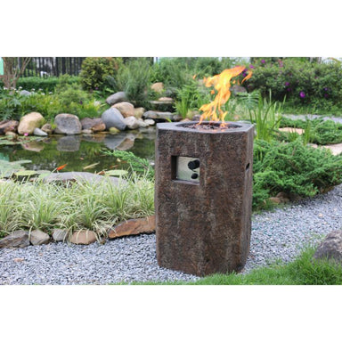 Modeno Basalt Concrete Fire Pit Column placed outdoors near the pond