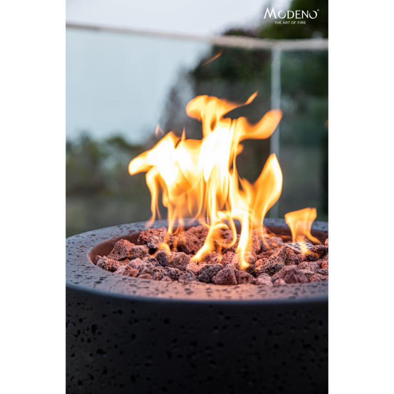 Modeno Lava Tube Concrete Fire Pit Column black showcasing its beautiful flames