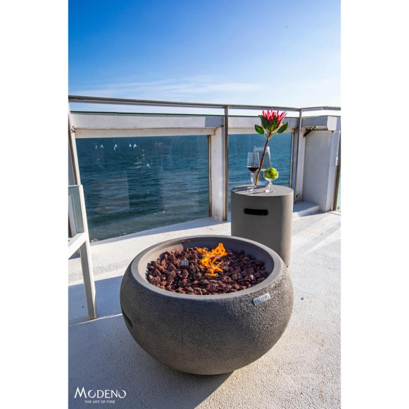 Modeno New Bridge Fire Bowl in Light Grey placed outdoors near the balcony