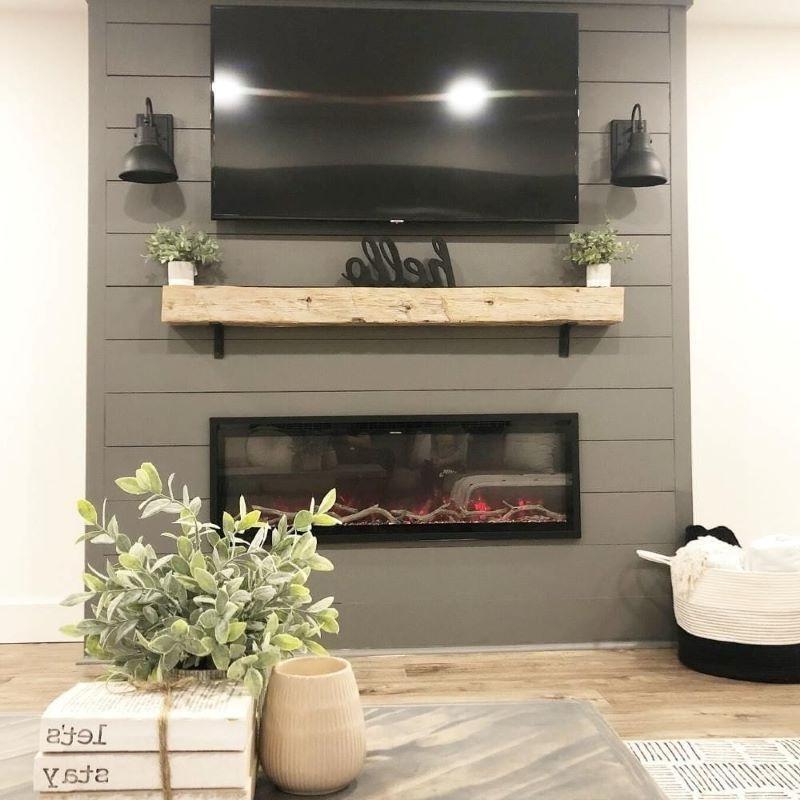 Modern Flames Spectrum Slimline Electric Fireplace in black under the mantel