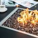 Showcasing the flames and fireglass of the Biano & Sofia Porcelain Fire Table