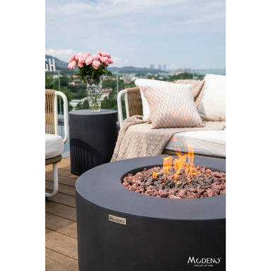 Showcasing the flames on the Modeno Venice Round Fire Pit in black