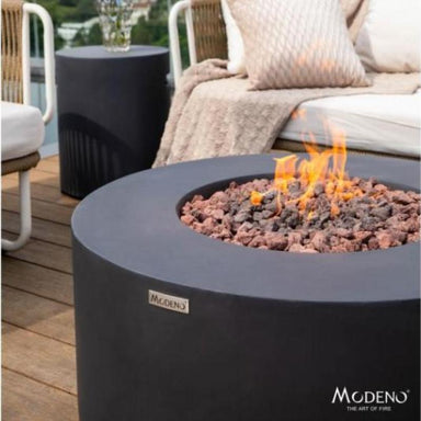 Showcasing the flames on the Modeno Venice Round Fire Pit in black