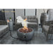 showcasing the powerful flames on the Newbridge Round Concrete Fire Bowl by Modeno