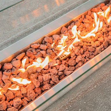 Showing the flames and the lava rocks on the Hapton Fire Table by Elementi in a closer angle