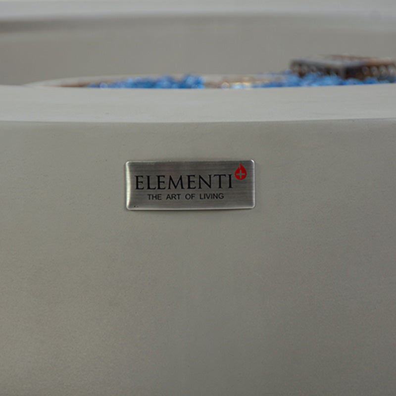 Texture and badge on the Elementi Plus Colosseo Round Fire Table