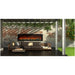 The Amantii Symmetry Smart XL Electric Fireplace is place d at the outside Patio