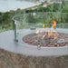 The Boulder by Elementi showcasing its flames and lava rocks outdoor with the optional windscreen