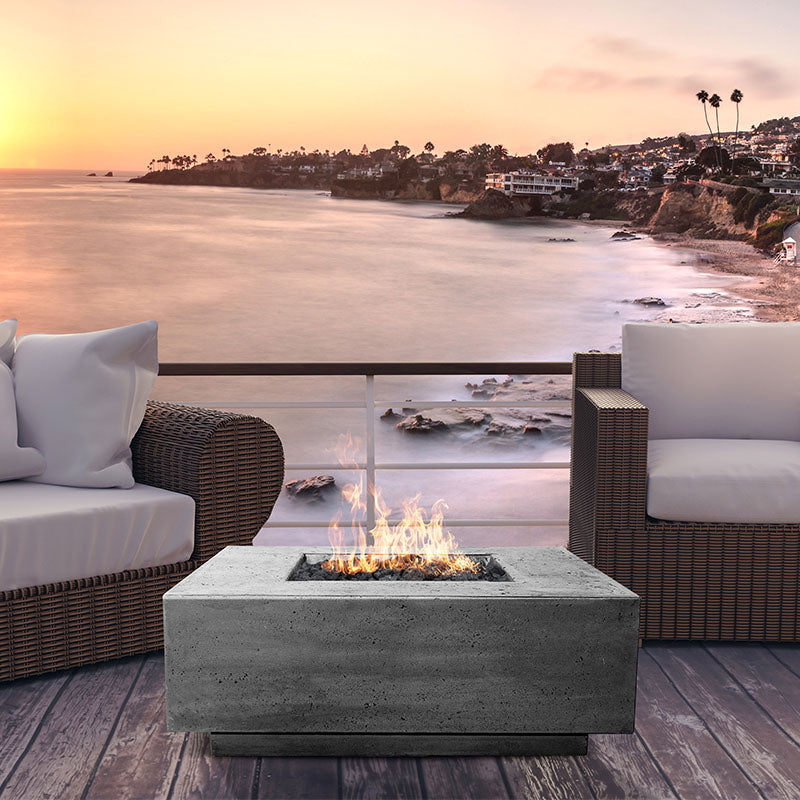 The Prism Hardscapes Tavola 3 Square Concrete Fire Pit by the beach