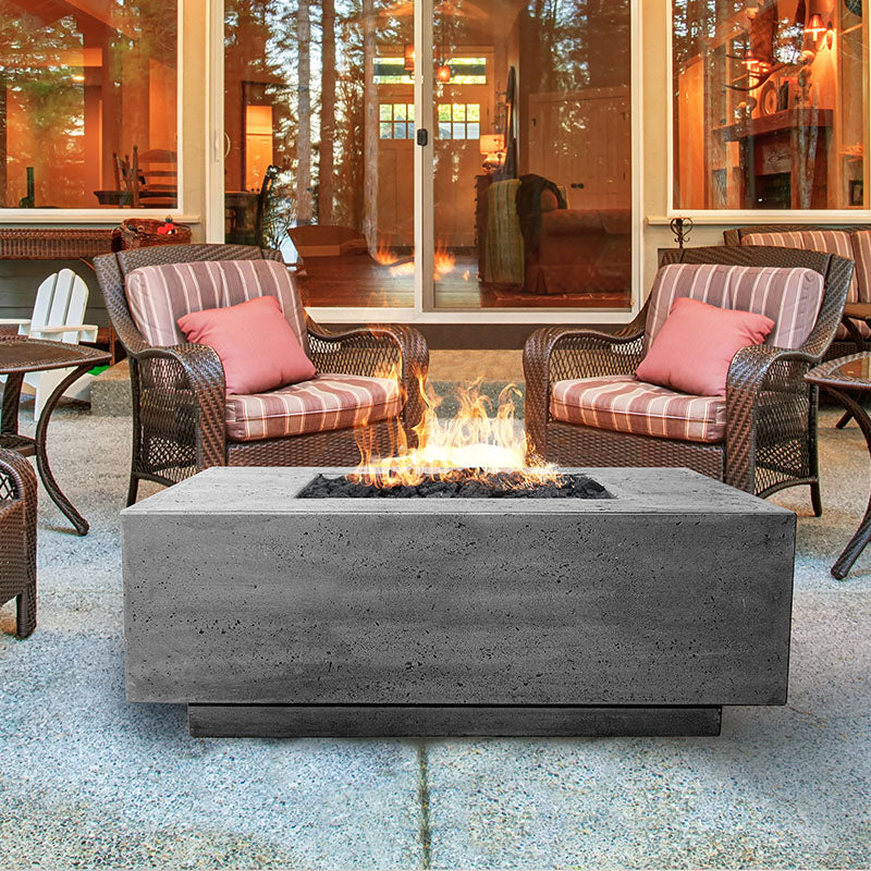 The Prism Hardscapes Tavola 3 Square Concrete Fire Pit installed on the outside patio