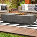 The Prism Hardscapes Tavola 4 Rectangular Concrete Fire Pit installed outside the patio