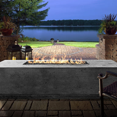 The Prism Hardscapes Tavola 4 Rectangular Concrete Fire Pit with a perfect dawn view