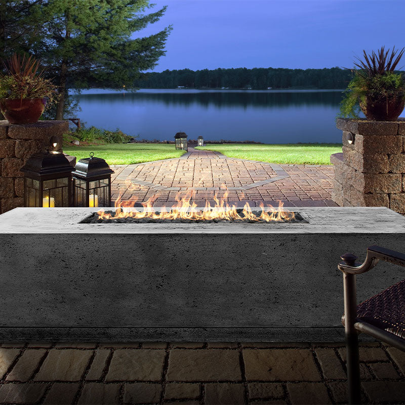 The Prism Hardscapes Tavola 4 Rectangular Concrete Fire Pit with a perfect dawn view