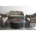 The Venice Fire pit in black is placed indoors to provide heat