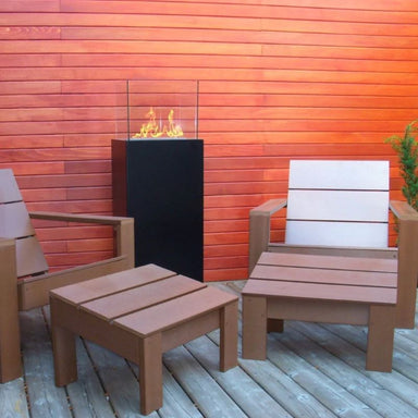 The Bio Flame Torch 2.0 placed Outdoor with chairs beside