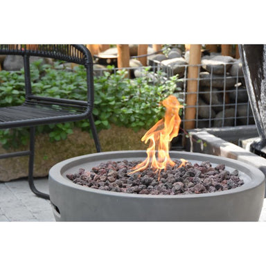 The mesmerizing flames on the nantucket Round Concrete Fire Bowl by Modeno