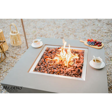 The powerful flames that is provided by the Westport Square Concrete Fire Pit by Modeno