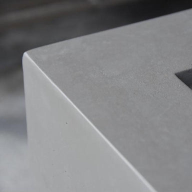 The texture on the Ridgefield Square Concrete Fire Pit by Modeno in Light Grey